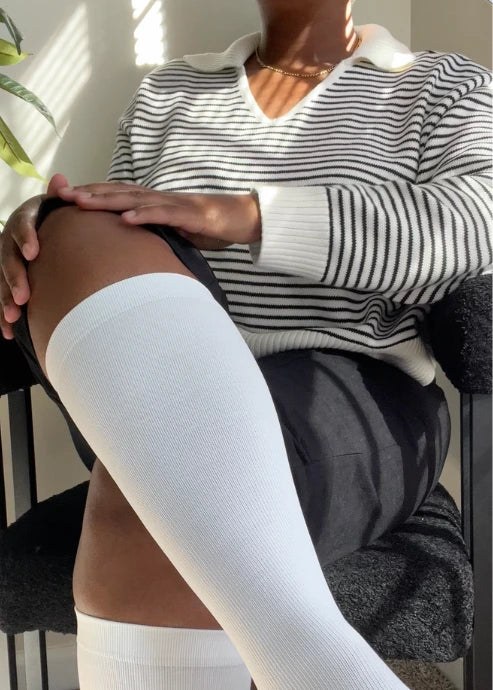 Woman wearing Everstride socks indoors