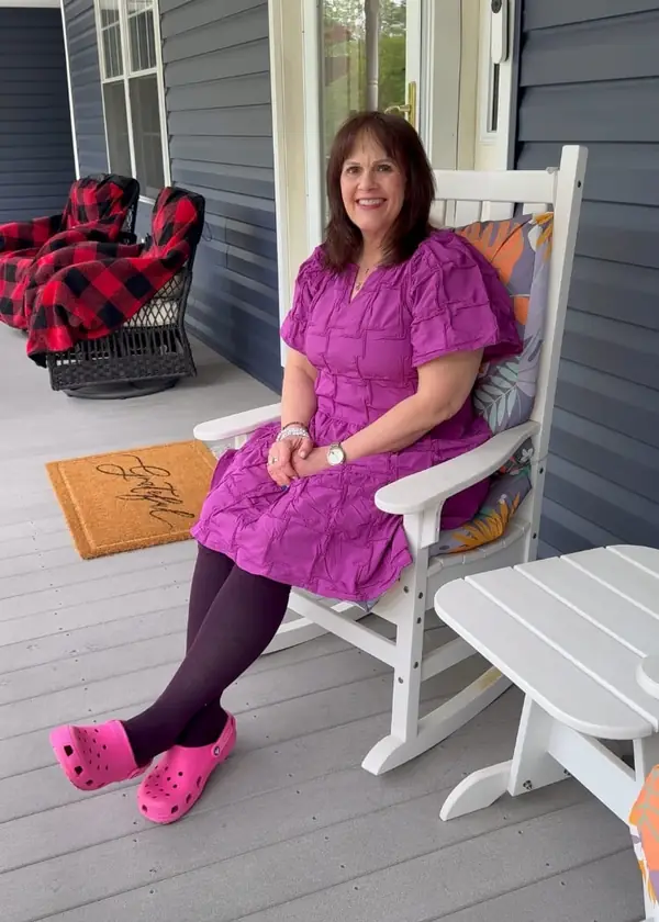 Customer relaxing on her porch in burgundy Everstride socks