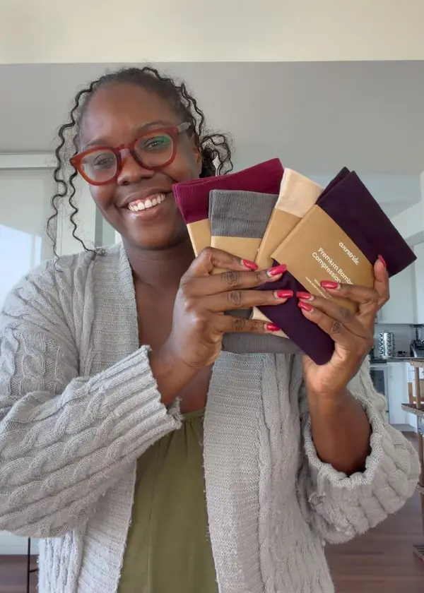 Customer holding several colors of Everstride socks