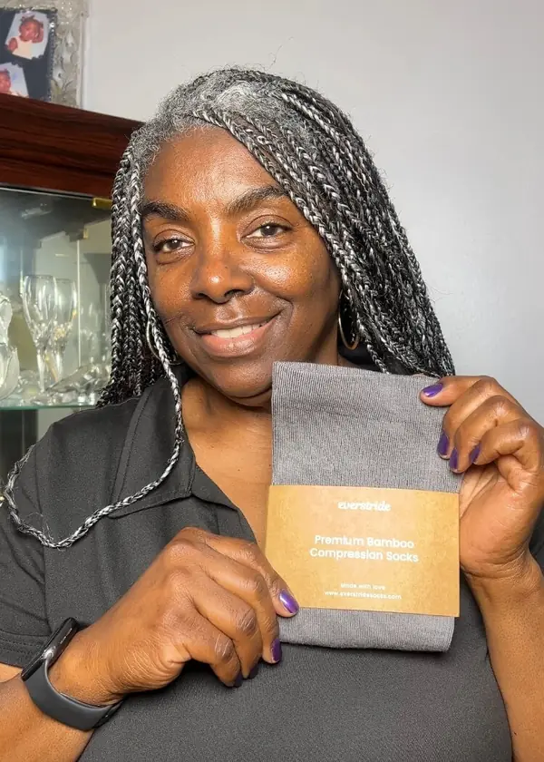 Customer holding her Everstride order in two colors